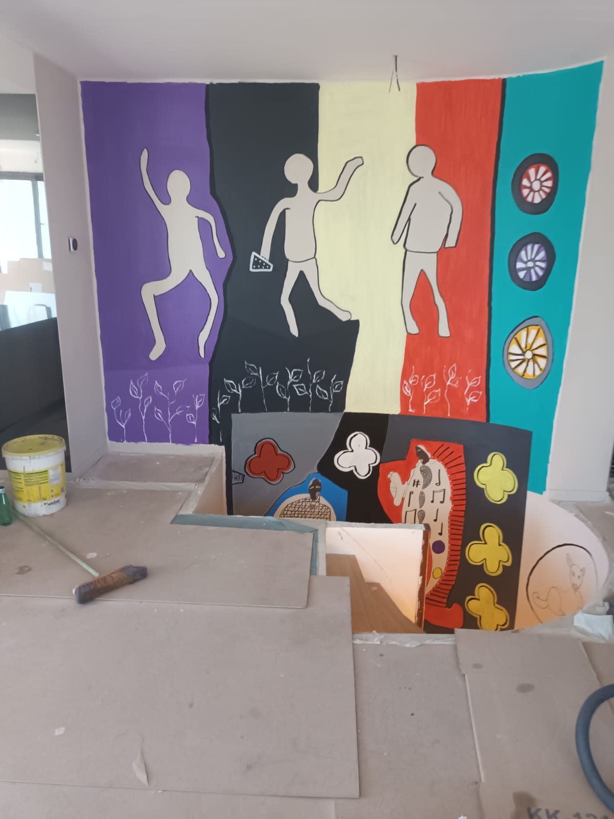Mural by Frantz Lamothe: three dancing figures against five vertical bands of colour