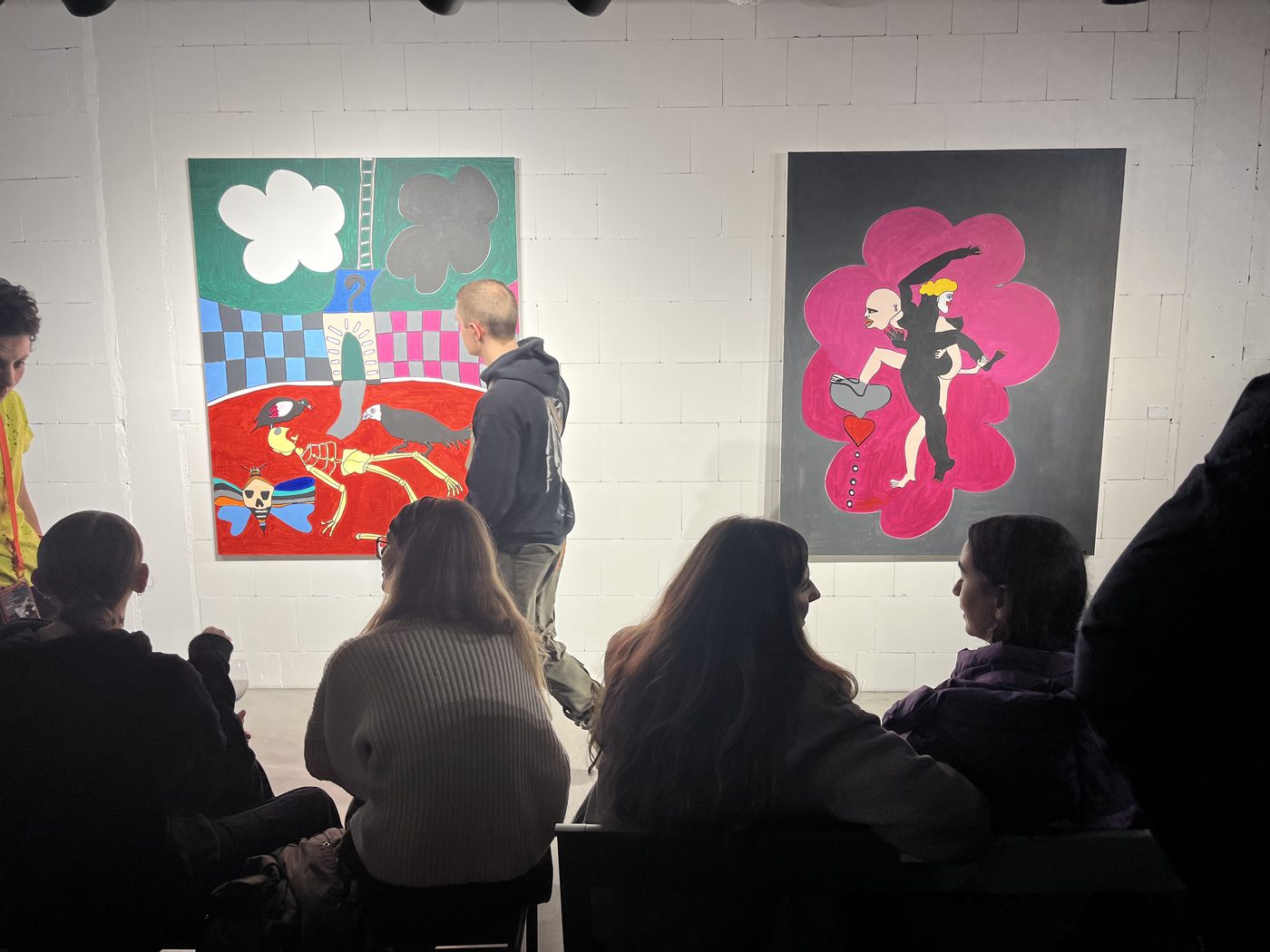Visitors in front of two paintings by Frantz Lamothe at Galerie SLP in Berlin